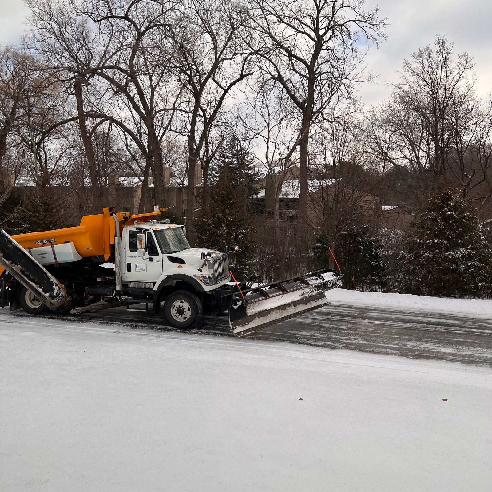 Snow plow clearing a commercial lot in Westfield Township, Ohio