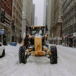 Plow truck clearing snow — snow plowing leads sources and costs